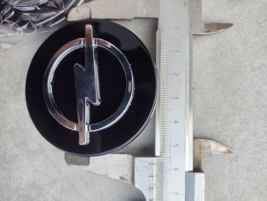 Dekle dekielki opel nowe 58mm / 55mm emblematy logo na alufelgi