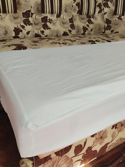 Простинь наматрасник водонепроникний в дитяче ліжечко на резинці