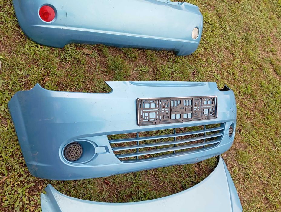 Chevrolet Matiz maska zderzak lampy