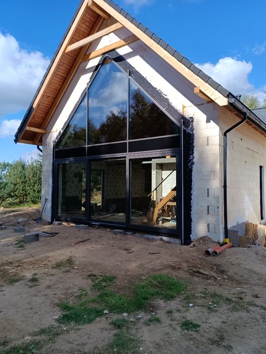 Prace ziemne koparko ładowarką Budowa Domów ICF  IZODOM
