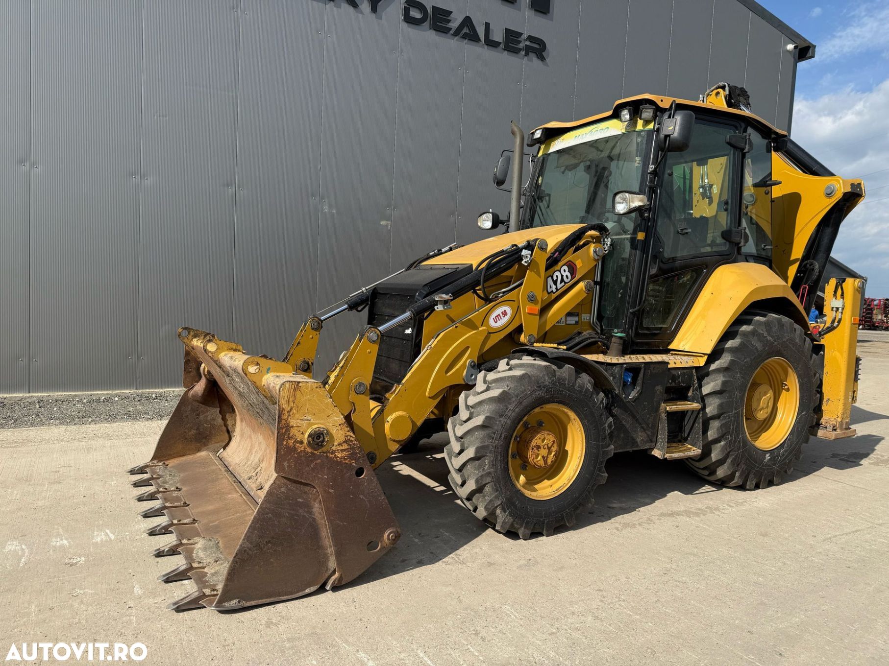 Cat 428 Buldoexcavator - 1