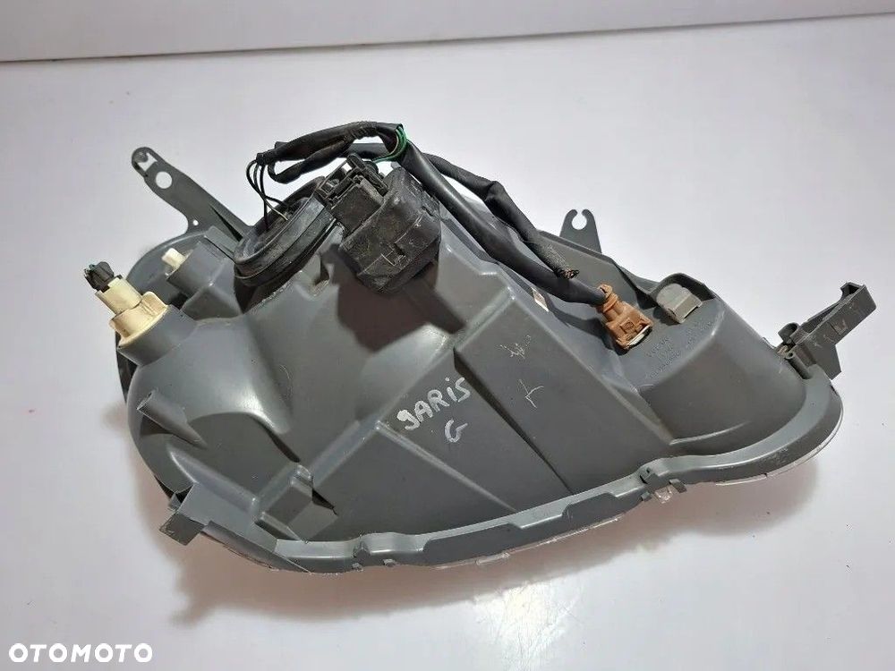 TOYOTA YARIS I LAMPA REFLEKTOR LEWY PRZÓD EUROPA 89008658 811700D080 - 11