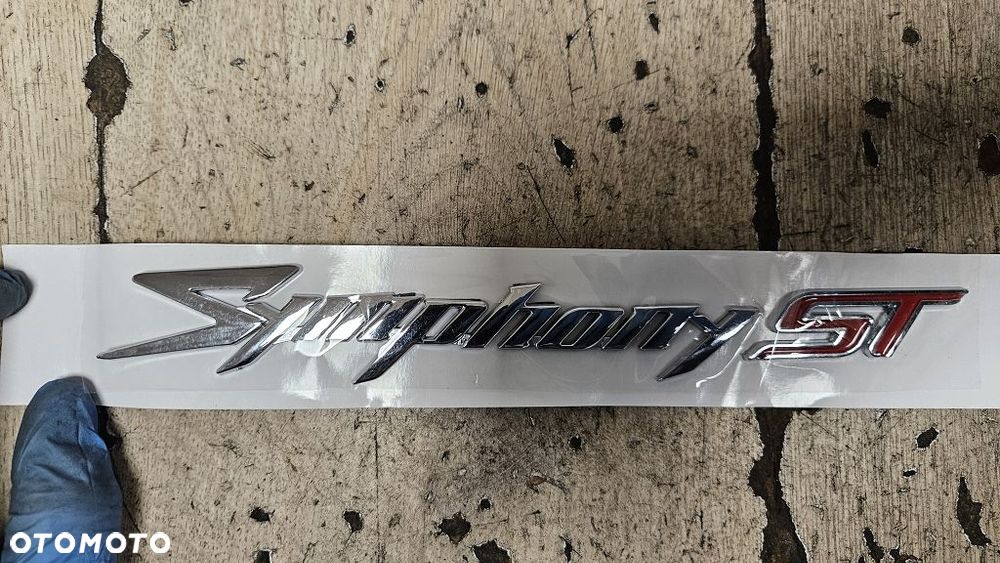 Emblemat Napis Lewy Sym Symphony ST 50 / 125 / 200i  87128-XPA-000 - 2