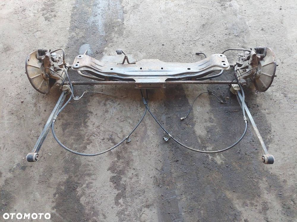 KOMPLETNE ZAWIESZENIE BELKA SANKI TYŁ MAZDA PREMACY I - 1