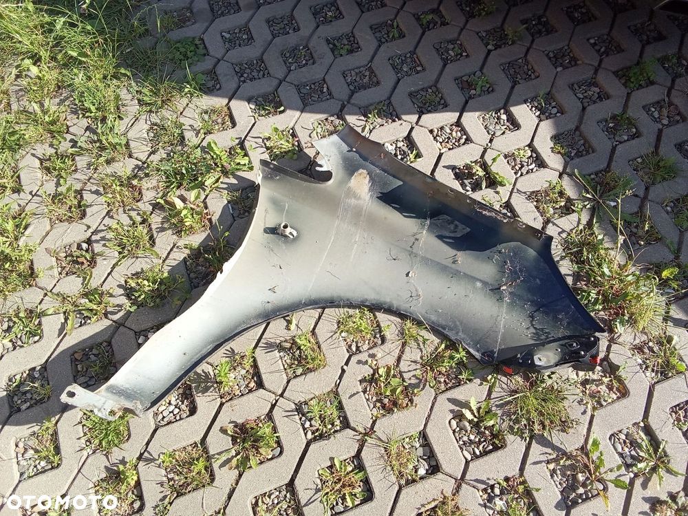 KL BŁOTNIK LEWY PRZÓD OPEL CORSA D 06- 5D - 5