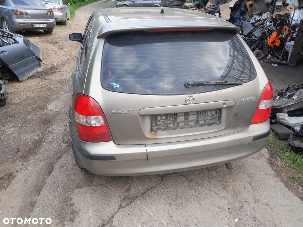 Mazda 323 323f BJ 98-03  Maska lampa zderzak pas atrapa 12M - 5