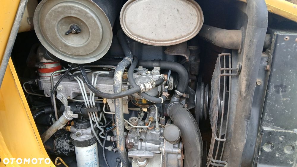 New Holland LB 115 - 32