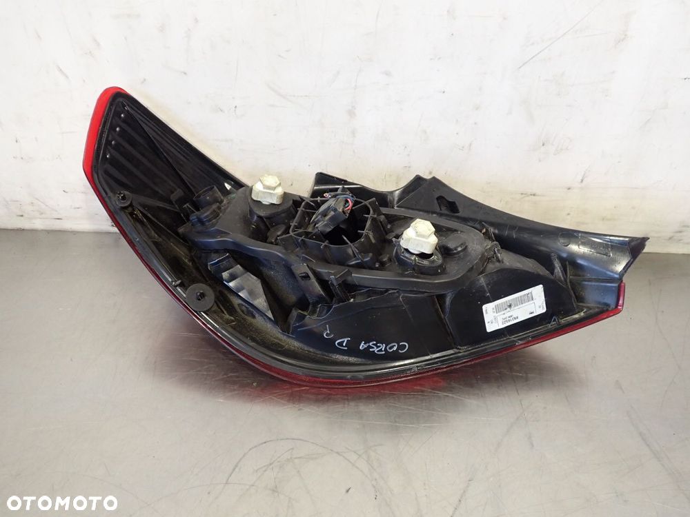 LAMPA PRAWA TYLNA DYMIONA OPEL CORSA D 89316522 - 7