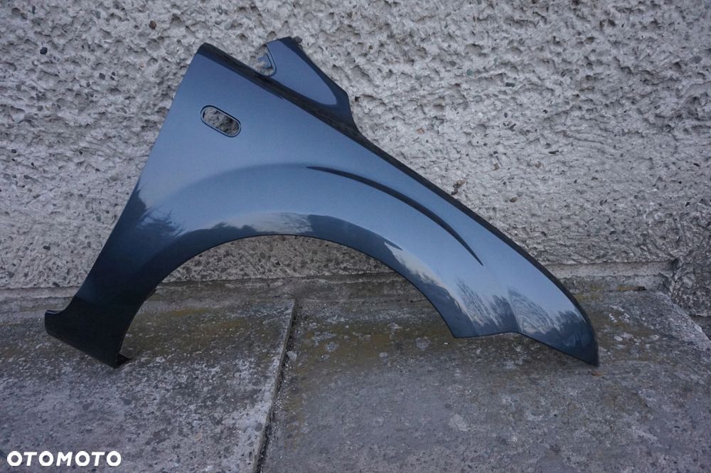 BŁOTNIK PRAWY FOCUS II MK2 04/08r H4