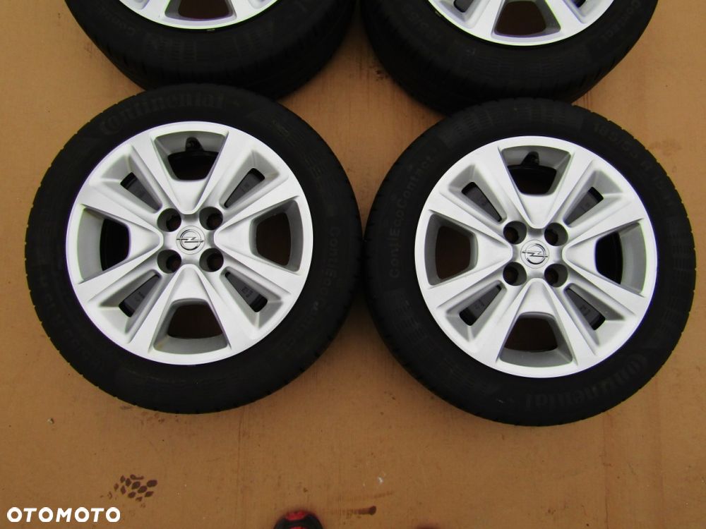 4x Felgi 15 Opel Adam Astra G H Corsa C D E Meriva Combo C + Kołpaki TPMS - 4