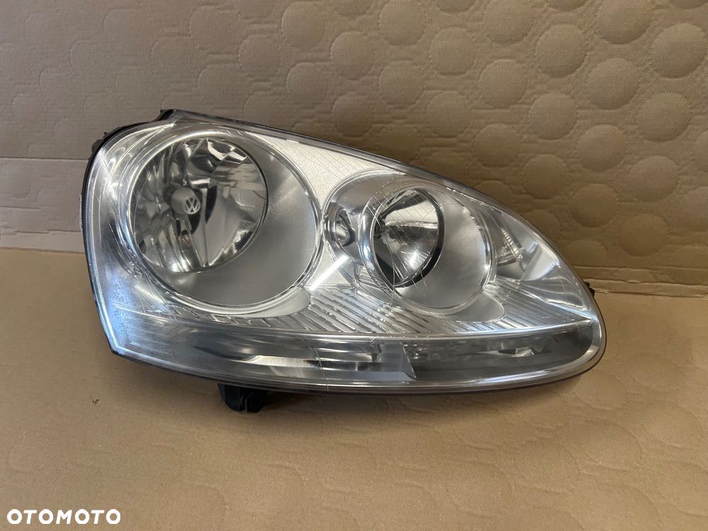 Lampa przednia prawa VW Golf V Jetta Hella Europejska - 1
