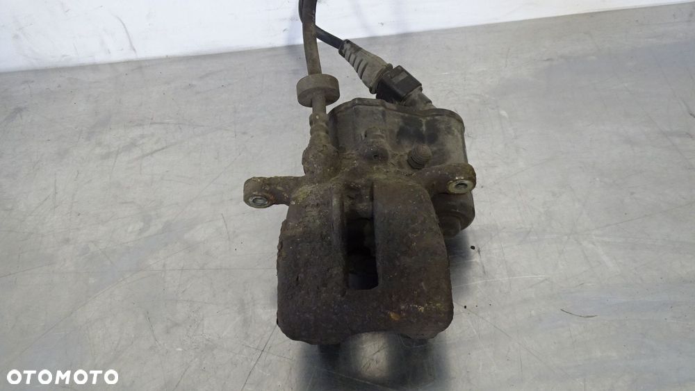 ZACISK HAMULCA PRAWY TYŁ AUDI A6 C6 2.7TDI - 1