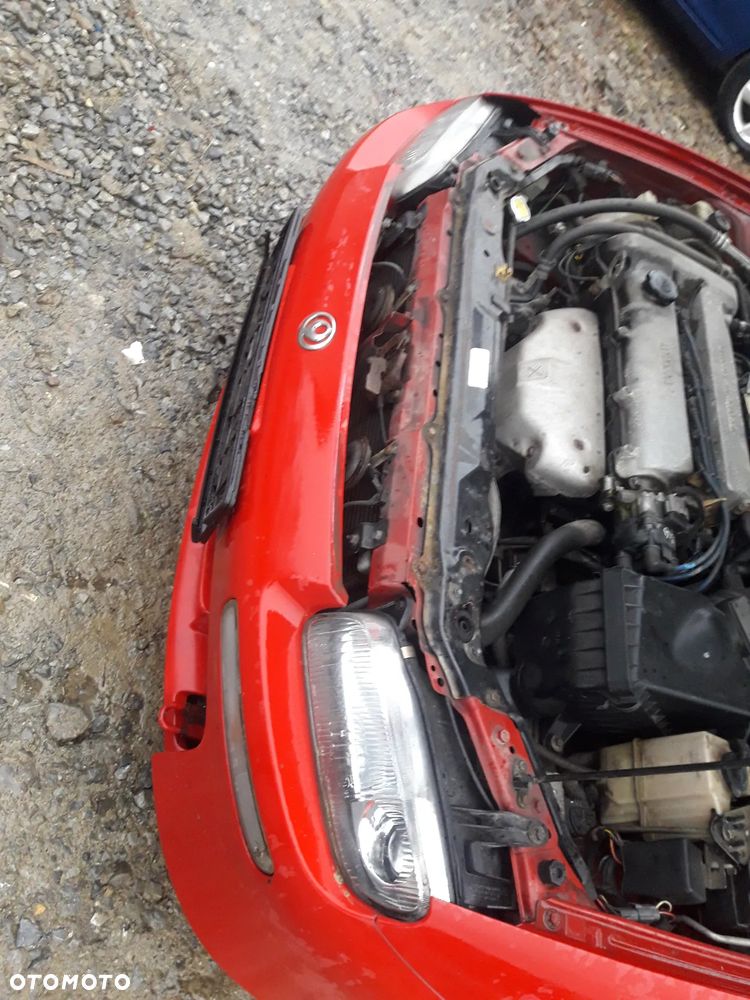 Mazda 323 323f BA 94-98  Maska lampa zderzak pas wzmocnienie 11R SU - 10