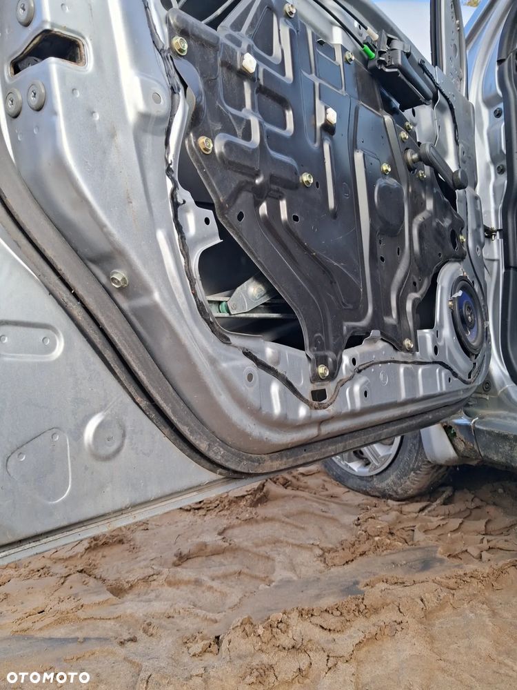 Daihatsu cuore 03 drzwi lewy przód E28 - 7