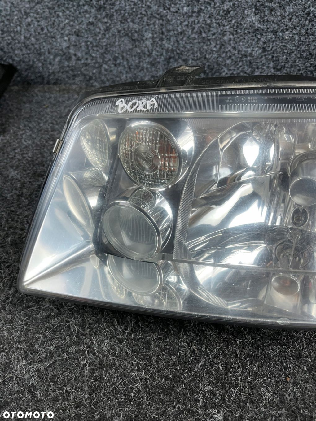 vw bora reflektor lampa lewy przód lewa przednia hella OE - 4
