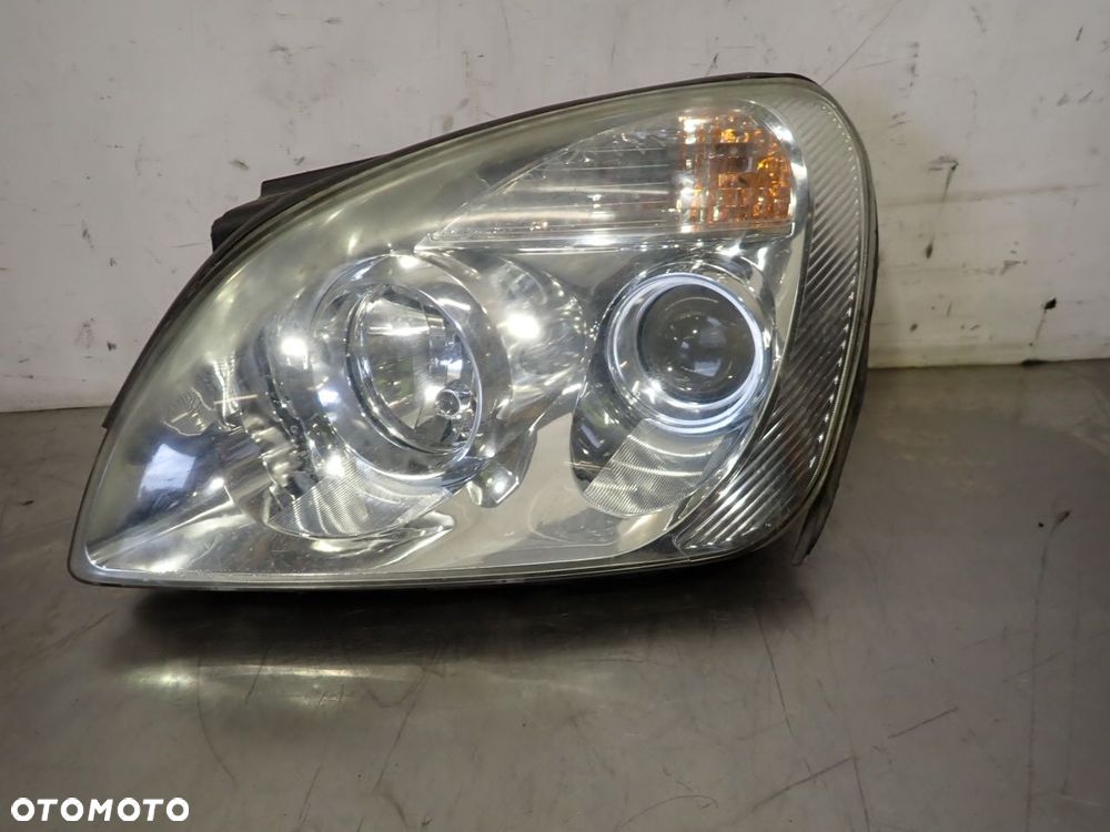 LAMPA LEWA PRZEDNIA KIA CARENS III - 1