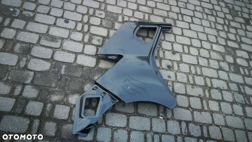 KIA VENGA BŁOTNIK TYLNY TYŁ PRAWY - 1