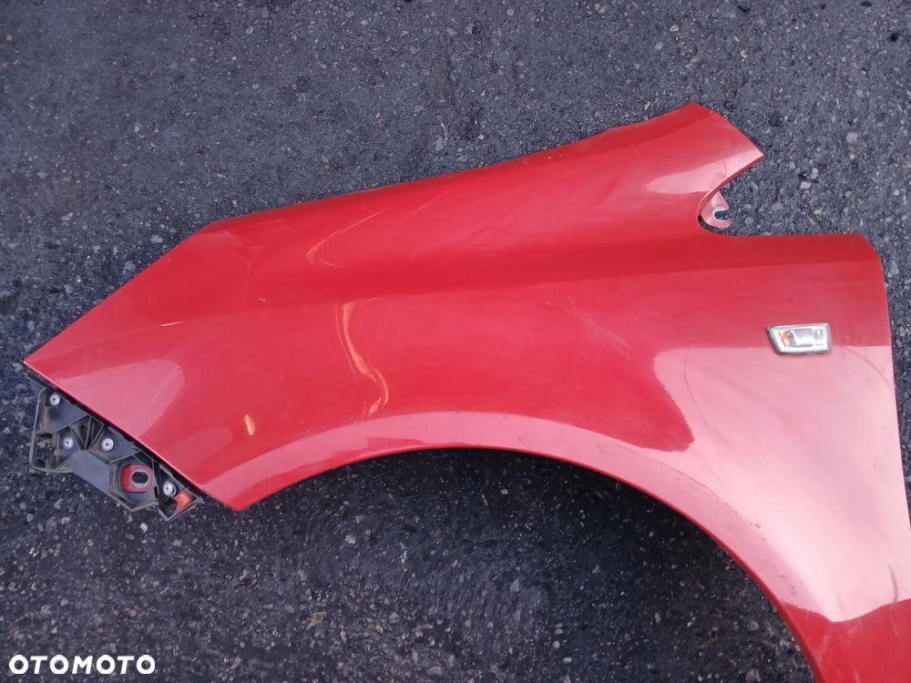 Opel Corsa D Błotnik lewy - 2