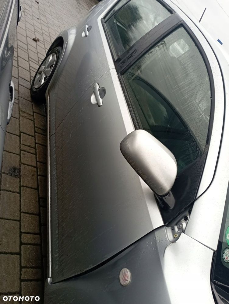 DAIHATSU SIRION II DRZWI PRAWE PRZÓD PRZEDNIE GOŁE