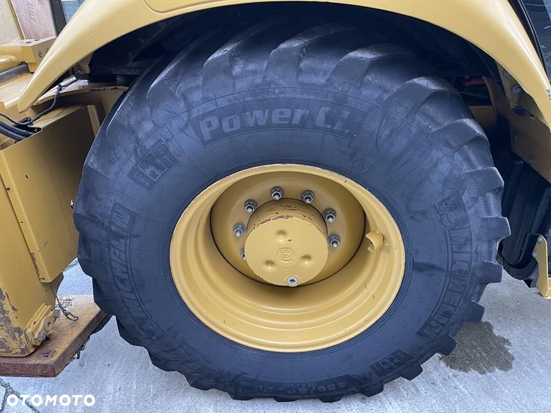 Caterpillar 428 F , rok 2012 Posiada w zestawie 4 łyżki, widły. - 8