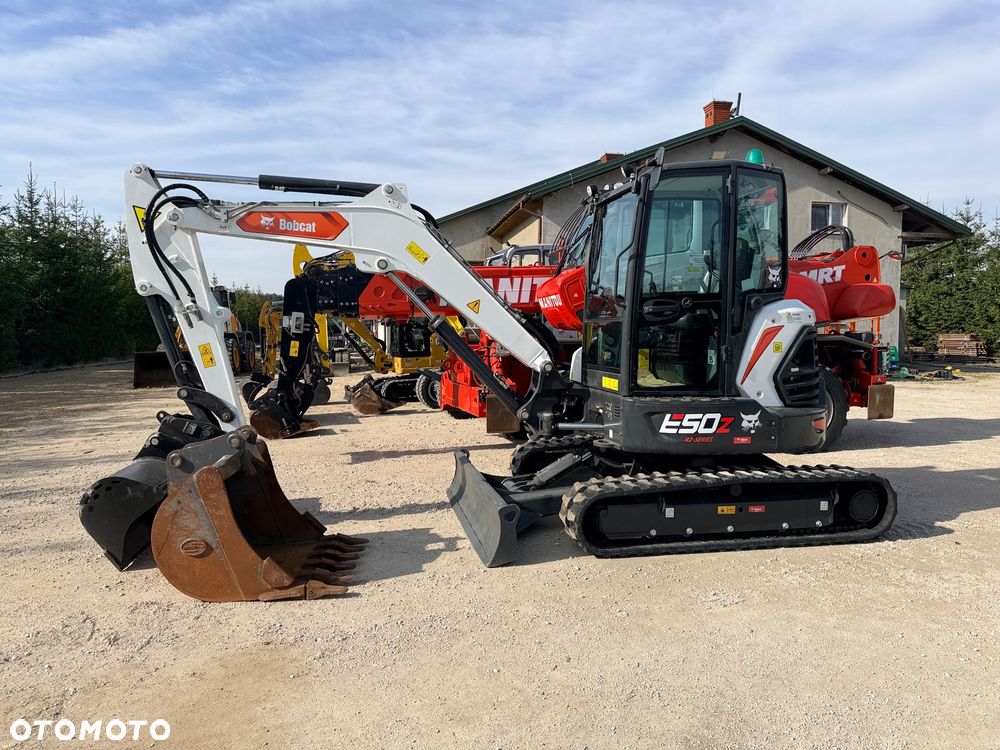 Bobcat Minikoparka Bobcat e50Z 5ton e55 e60 Cat 303.5 304  305 3xłyżki Ramię LOONG dodatkowe linie hydr wyjścia AUX1 + 2 przeciw waga MAX-dociążenie gąsienice 85% od nowości 1 właściciel z Niemiec Auto IDLEE po serwisie Widły wiertnica grabie i inne za dopłatą Szybkozłącze hydr Miller łyżka przedsiębierna Pług  Kubota Takeuchi Jcb - 25