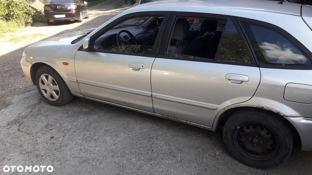 Mazda 323 323f BJ 98-03 Lift  Maska lampa zderzak pas atrapa 22V - 7