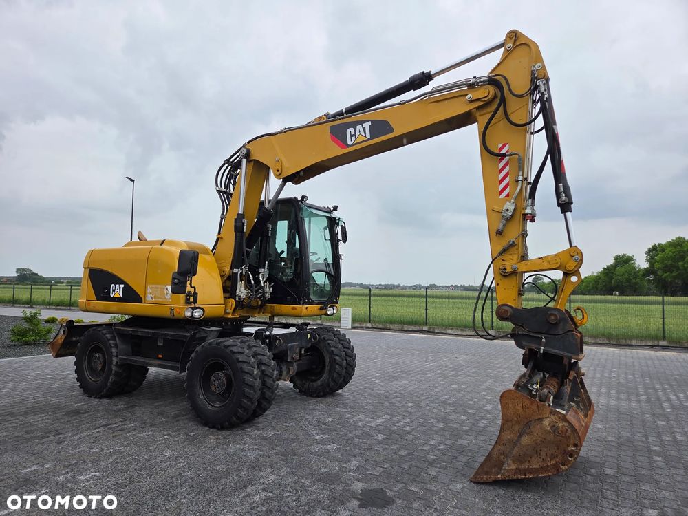 Caterpillar M313D / spr. ze Szwajcarii / - 6