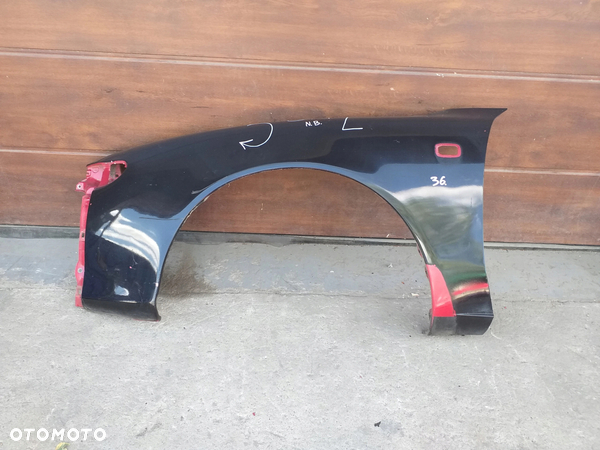 TOYOTA CELICA V 5 błotnik przód przedni LEWY