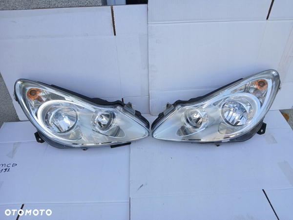 OPEL CORSA D lampa lewa prawa przód 13186382 13186381 Europa