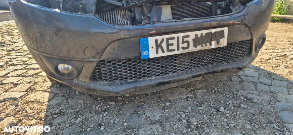 Bara spoiler fata cu proiectoare / are defect / lipseste partea de sus Dacia Logan MCV 2