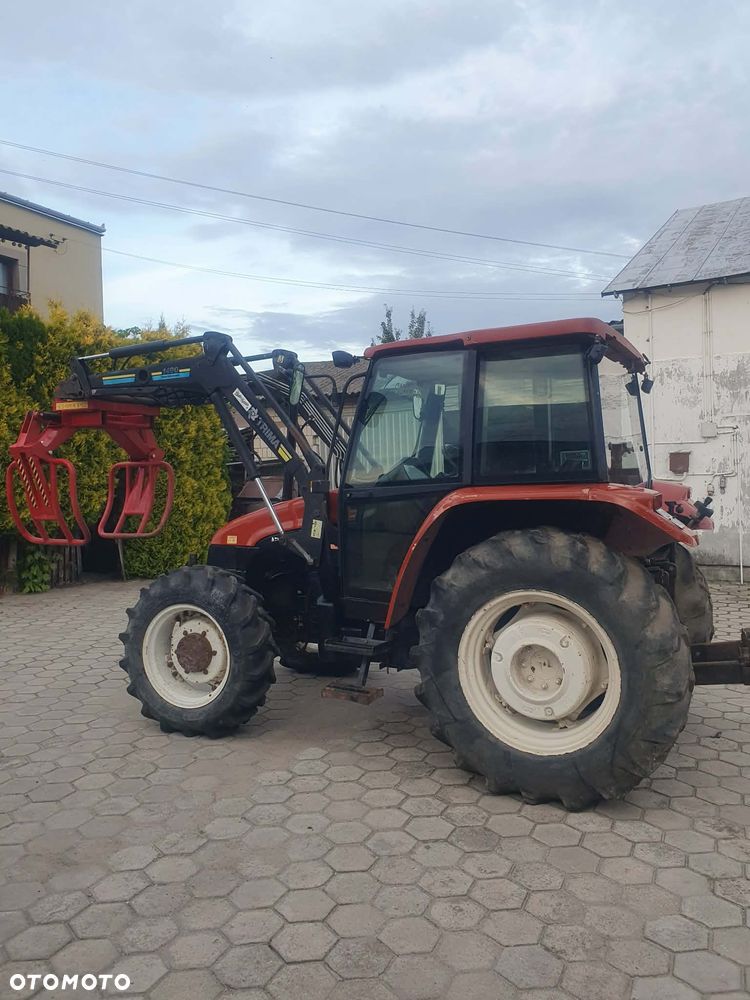 New Holland L65 DT z turem - 5