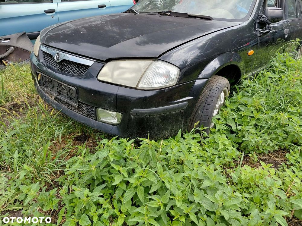 części LAMPA PRZÓD prawa lewa MAZDA 323F 2002r 1.5 benzyna hatchback - 1