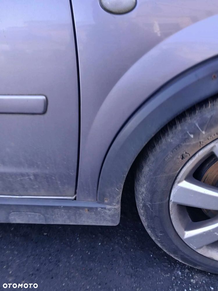 Opel Corsa C Błotnik prawy,  kod lakieru Z166 - 4