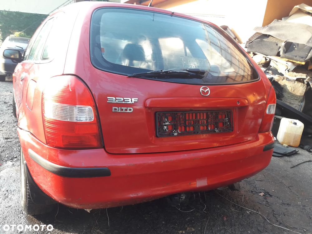 Mazda 323 323f 323  BJ 98-03  Maska lampa zderzak pas zamek w kolor SU - 5