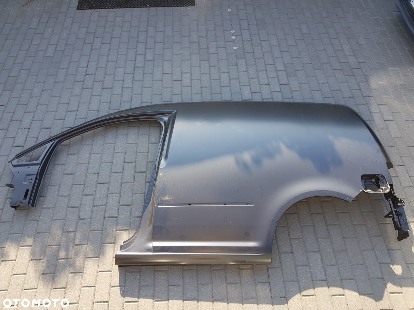 NOWY LEWY BŁOTNIK VW CADDY III 3 4 IV 2K 2K5 04-20r POSZYCIE SŁUPEK  LEWA 2K5809603A - 1