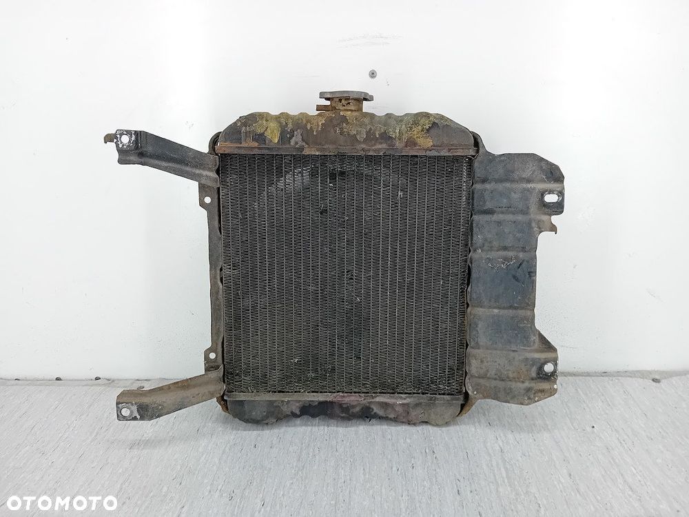 CHŁODNICA WODY Z WENTYLATOREM NISSAN SUNNY B11 1.3 - 1
