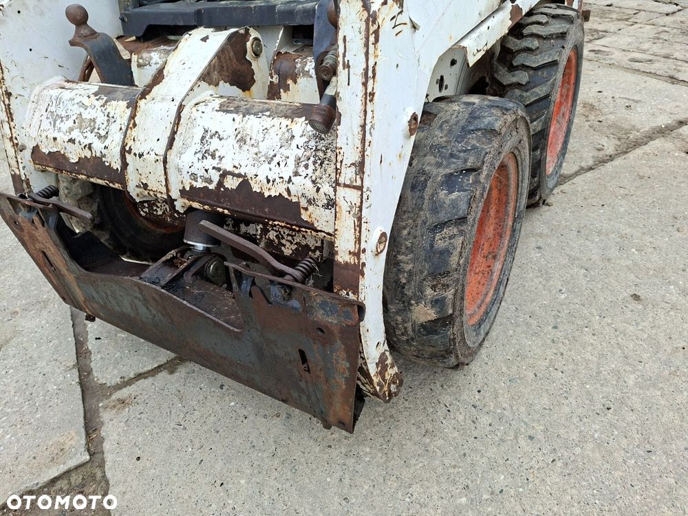 Bobcat 553 4X4 + Melroe Ingersoll-Rand 725S B/H - 36