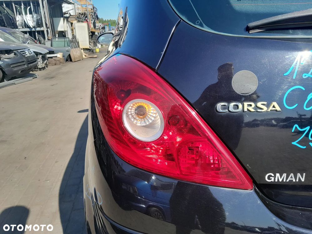 OPEL CORSA D LAMPA TYLNA LEWA W BŁOTNIK 3D - 1