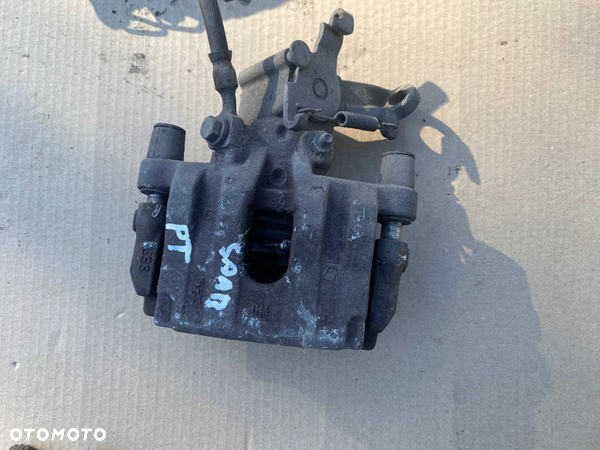 saab 93 sedan zacisk hamulcowy prawy tył tylny jarzmo 03rok