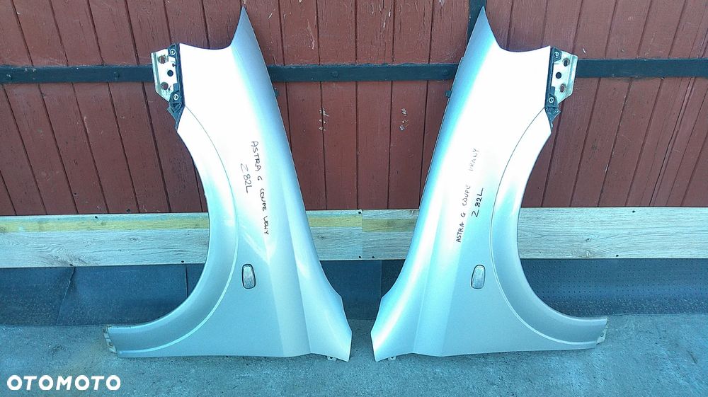 OPEL ASTRA II G BERTONE BŁOTNIK PRAWY Z82L