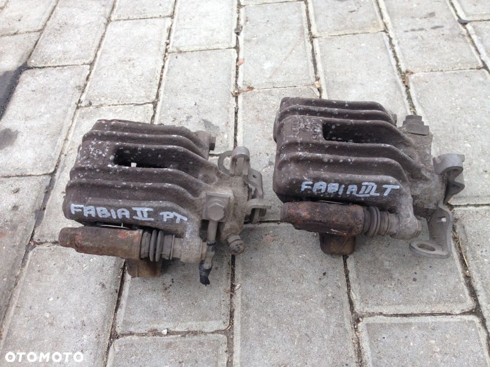 FABIA II ROOMSTER ZACISK HAMULCOWY TYŁ PRAWY LEWY - 1