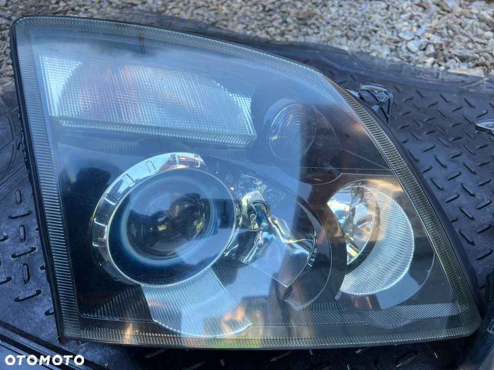 OPEL VECTRA C REFLEKTOR XENON PRAWY LAMPA PRAWA KOMPLETNA CIEMNA 159872-00 ORYGINAŁ - 1