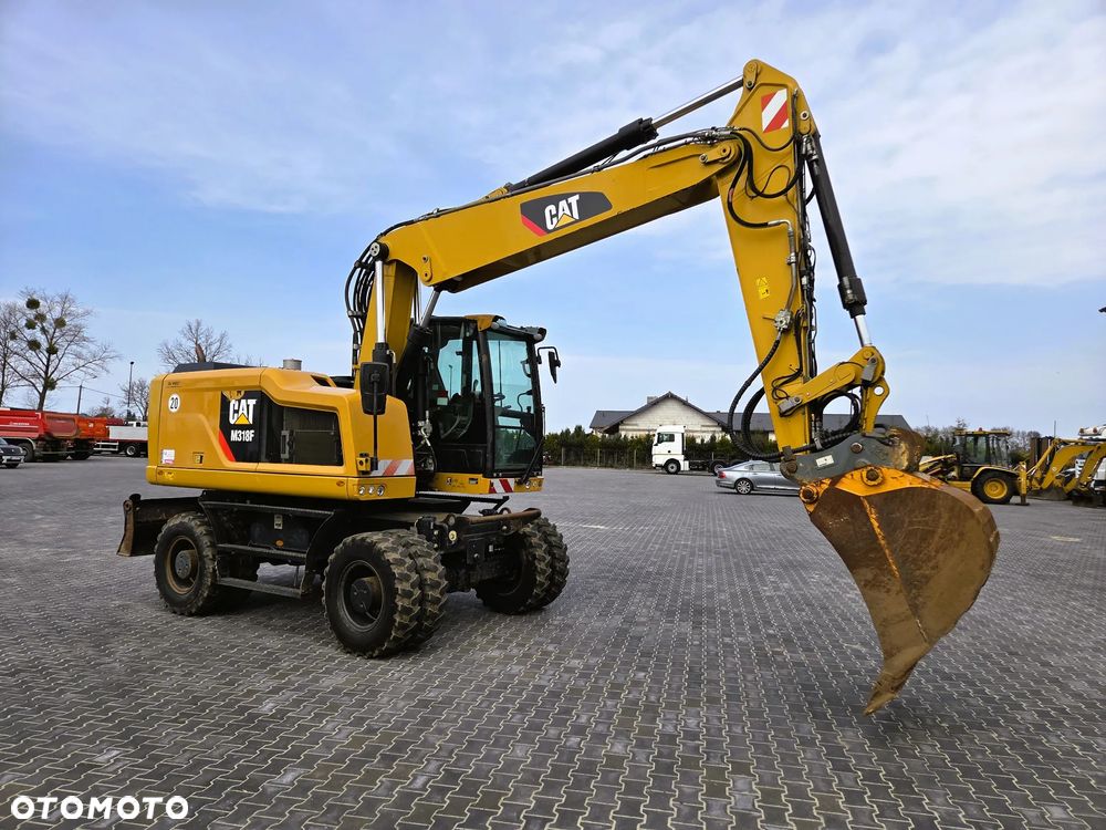 Caterpillar M 318F / z Niemiec /  9300 mth / - 2