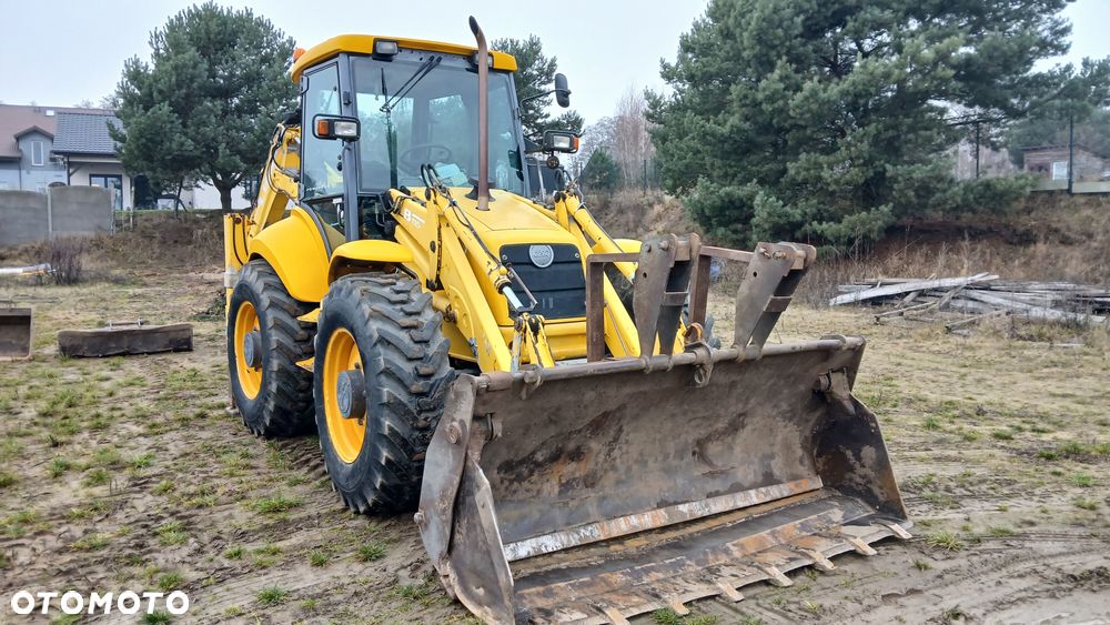 New Holland LB 115 - 5