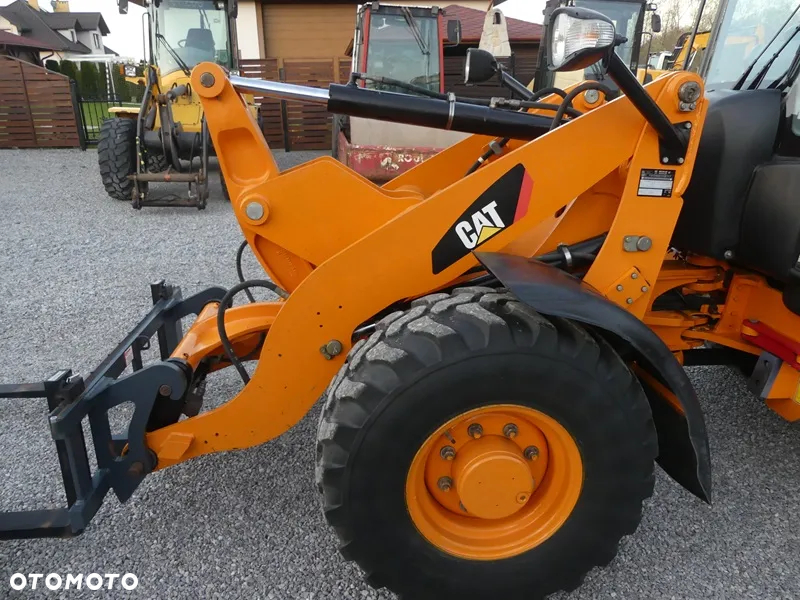 Caterpillar CAT 906H / Z Niemiec / 6424mtg / - 25