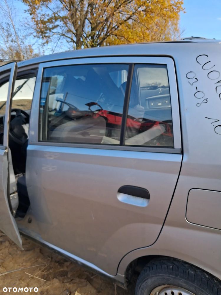 Daihatsu cuore 03 drzwi lewy tyl E28 - 2