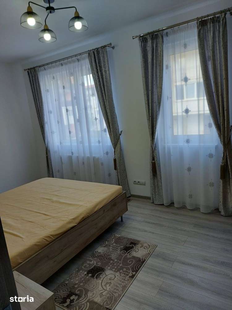 Apartament cu 3 camere,etaj intermediar,parcare subterana,zona Eroilo — fotografia 3