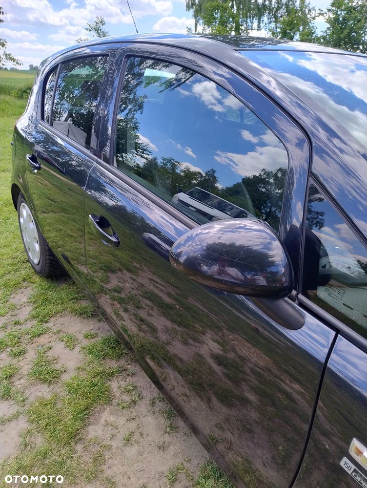 Opel Corsa 1.4 16V Cosmo - 8