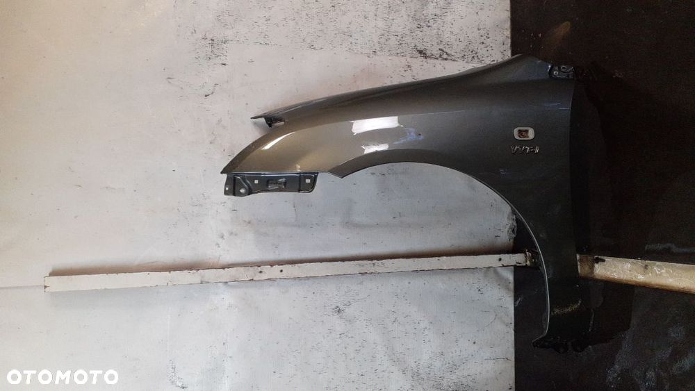 * TOYOTA COROLLA E12  BŁOTNIK PRZÓD LEWY 1G3 - 1