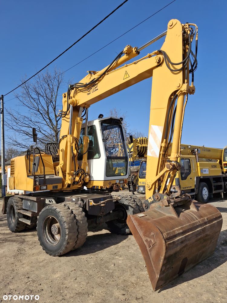 Liebherr A312 CAT JCB - 1